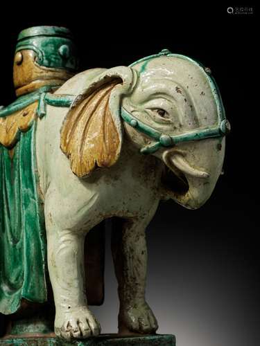 A SANCAI-GLAZED ‘ELEPHANT’ CANDLEHOLDER, MING DYNASTY