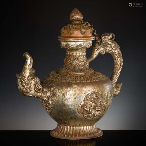 A MASSIVE SILVERED-COPPER RITUAL TEAPOT AND COVER, TIBET, 19...