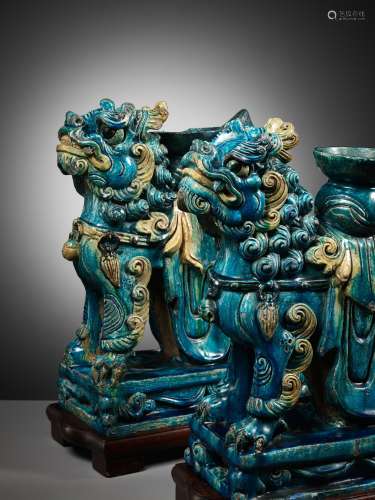 A MASSIVE PAIR OF TURQUOISE AND CREAM-GLAZED ‘BUDDHIST LION’...