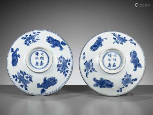 A PAIR OF BLUE AND WHITE ‘LIONS AND PEONY’ PORCELAIN BOWLS, ...