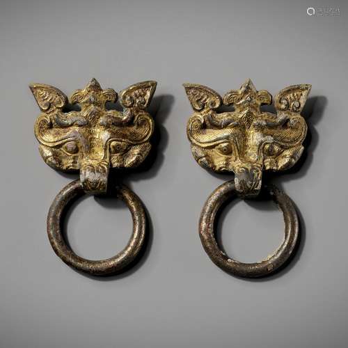 A PAIR OF GILT-BRONZE TAOTIE MASKS WITH RING HANDLES, WARRIN...