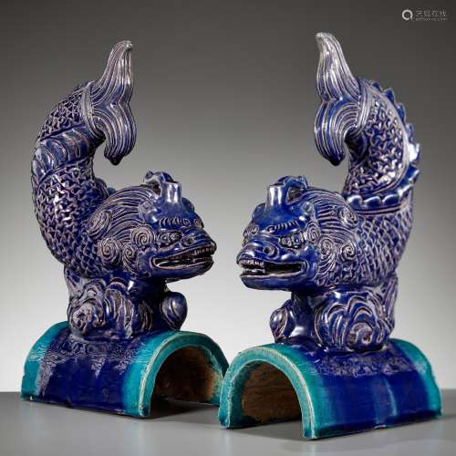 A PAIR OF AUBERGINE AND TURQUOISE-GLAZED ‘DRAGON-CARP’ ROOF ...