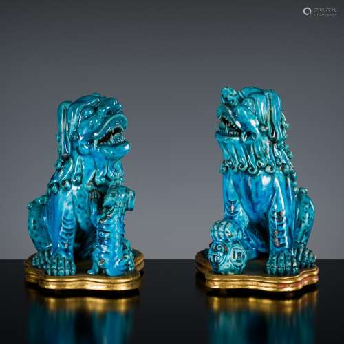 A PAIR OF TURQUOISE-GLAZED FIGURES OF BUDDHIST LIONS, KANGXI...