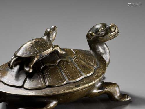 A SILVER-INLAID BRONZE FIGURE OF A TORTOISE AND YOUNG, ATTRI...