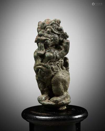 A BRONZE BELL FINIAL IN THE FORM OF RAKSHASA, EASTERN JAVANE...