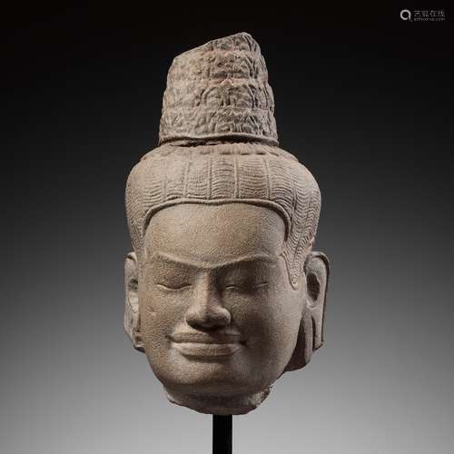 A SANDSTONE HEAD OF BUDDHA, ANGKOR PERIOD, BAYON STYLE