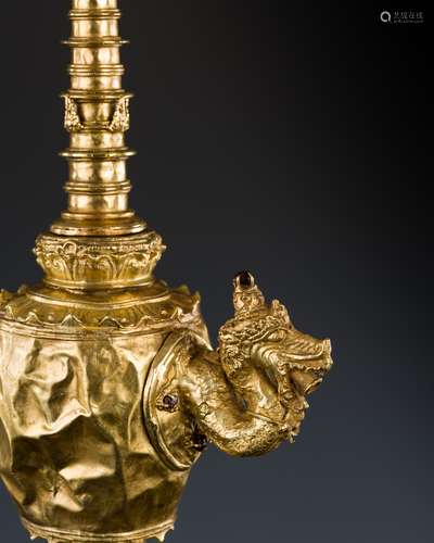 A GOLD REPOUSSÉ OIL LAMP, KAMANDALU, JAVA, INDONESIA, 13TH-1...