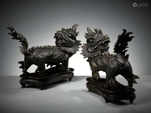 A PAIR OF HEAVY BRONZE FIGURES OF QILIN, MING DYNASTY