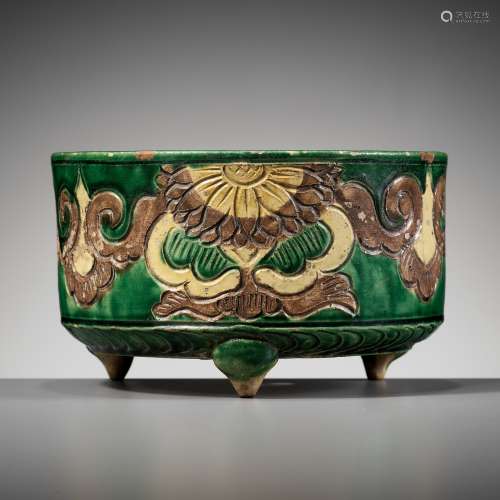 A GREEN, AUBERGINE, AND YELLOW-GLAZED TRIPOD CENSER, LIAO DY...