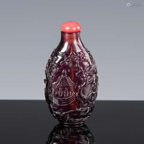 A CARVED ‘IMITATION AMETHYST’ GLASS SNUFF BOTTLE, QING DYNAS...