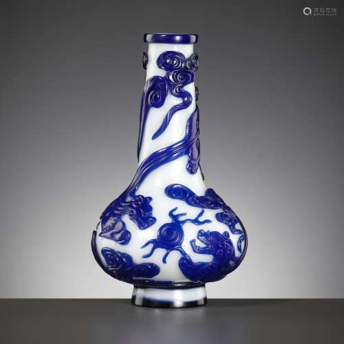A SAPPHIRE-BLUE OVERLAY GLASS ‘CHILONG’ BOTTLE VASE, QIANLON...