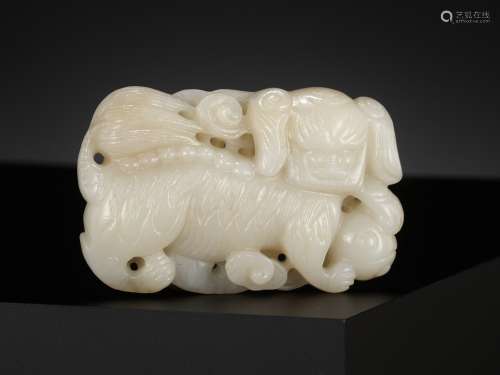 A WHITE JADE 'BUDDHIST LION' BELT BUCKLE, CHINA, 18TH CENTUR...