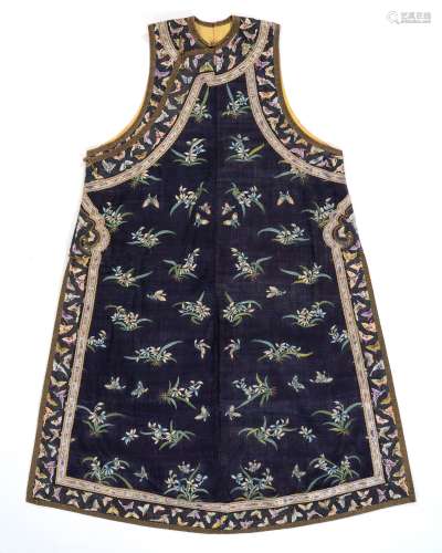 A MANCHU LADY'S INFORMAL ‘ORCHID AND BUTTERFLIES’ KESI VEST,...