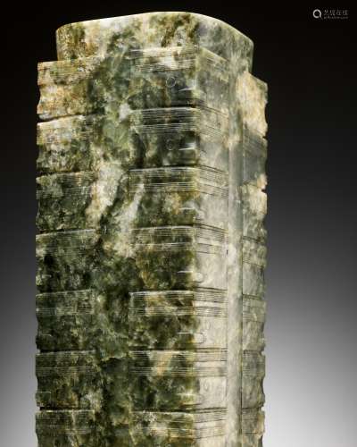 A RARE AND MASSIVE NINE-TIERED GREEN AND RUSSET JADE CONG, L...