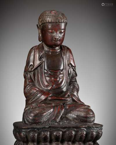 A RED-LACQUERED WOOD FIGURE OF BUDDHA, LATE MING DYNASTY
