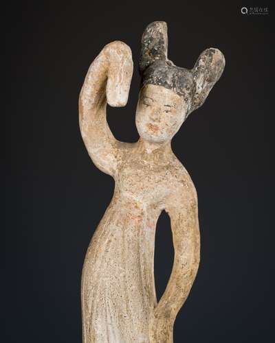 A PAINTED POTTERY FIGURE OF A DANCING LADY, TANG DYNASTY