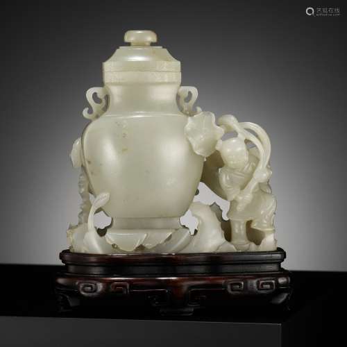 A CELADON JADE ‘BOY AND CHILONG’ VASE AND COVER, LATE QING T...