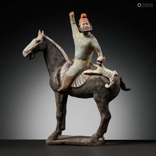 A RARE PAINTED POTTERY HORSE WITH A ‘PHRYGIAN’ RIDER AND TIG...