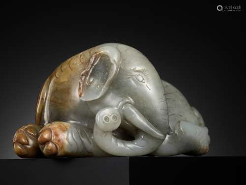 A GRAY AND RUSSET JADE FIGURE OF A RECUMBENT ELEPHANT, LATE ...