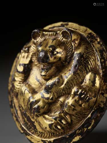 A GILT BRONZE ‘BEAR’ WEIGHT, HAN DYNASTY, EX ADOLPHE STOCLET...