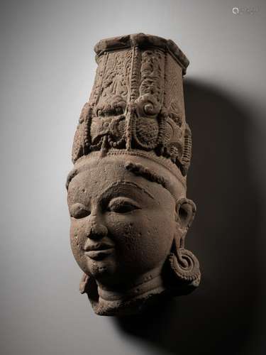 A LARGE PINK SANDSTONE HEAD OF VISHNU, NORTHERN OR CENTRAL I...