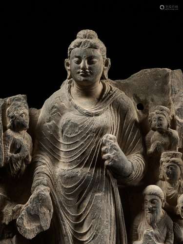 A LARGE GRAY SCHIST RELIEF DEPICTING BUDDHA, A ROYAL DONOR A...