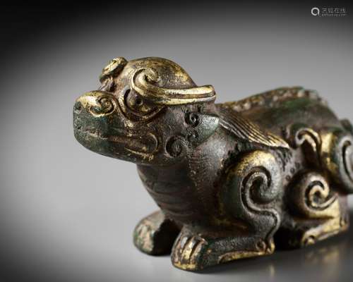 A GILT BRONZE LION-FORM WEIGHT, LATE MING DYNASTY