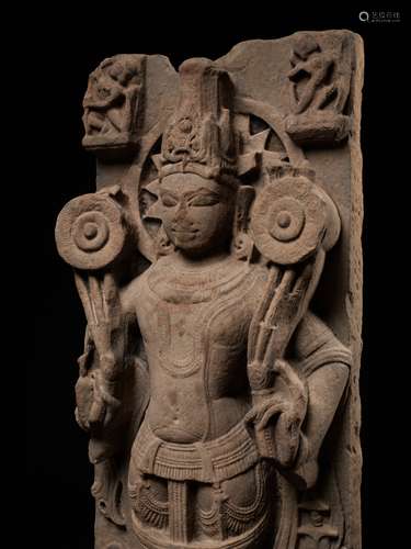 A MONUMENTAL SANDSTONE STELE OF SURYA, NORTHERN INDIA, UTTAR...