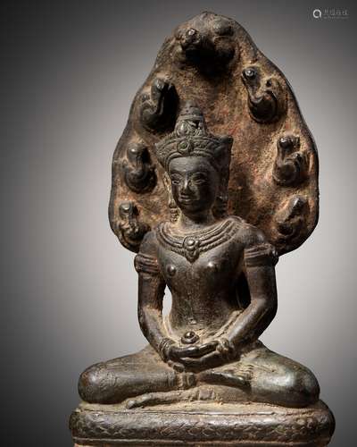 A BRONZE FIGURE OF BUDDHA MUCHALINDA, KHMER EMPIRE, ANGKOR P...