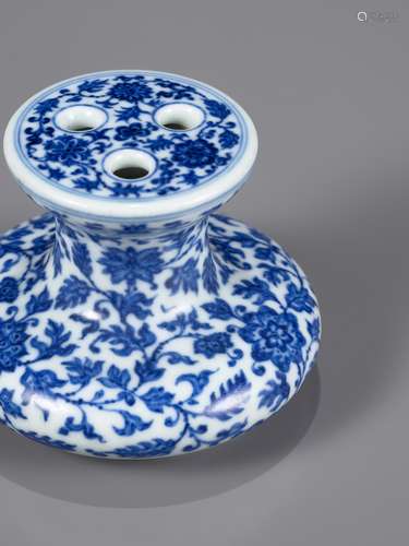 A BLUE AND WHITE MING-STYLE FLOWER-HOLDER, QIANLONG MARK AND...