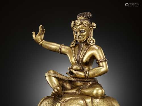 A SILVER-INLAID AND GILT-BRONZE FIGURE OF MAHASIDDHA, THE MY...