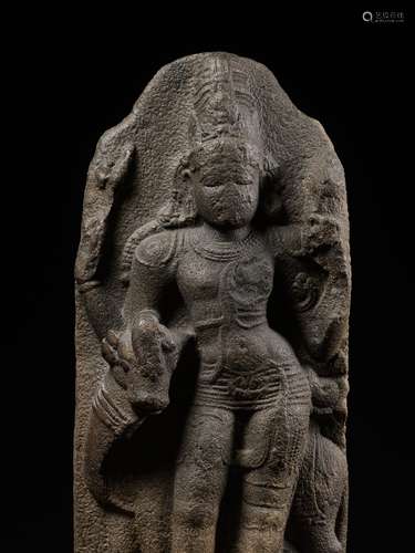 A GRANITE STELE OF SHIVA ARDHANARISHVARA AND NANDI, CHOLA PE...