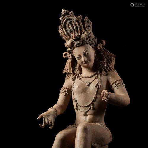 A LARGE AND HIGHLY IMPORTANT POTTERY FIGURE OF A MALE DEITY,...