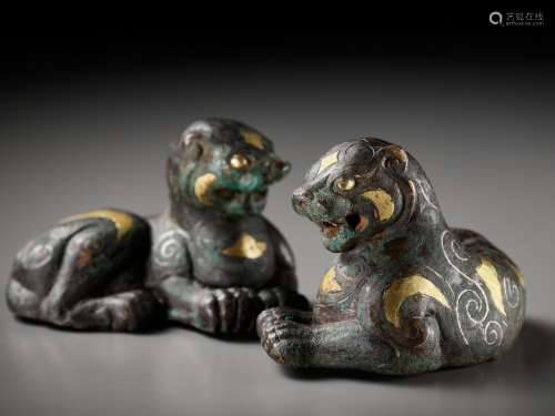 A PAIR OF SILVER- AND GOLD-INLAID BRONZE ‘TIGER’ WEIGHTS, HA...