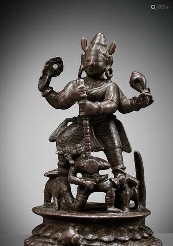 A BRONZE FIGURE OF DURGA SLAYING THE BUFFALO-DEMON MAHISHA, ...