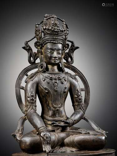 A LARGE BRONZE FIGURE OF RATNASAMBHAVA, CENTRAL TIBET, 13TH-...