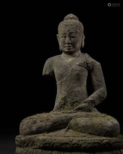 A VOLCANIC STONE FIGURE OF BUDDHA, CENTRAL JAVA, INDONESIA, ...