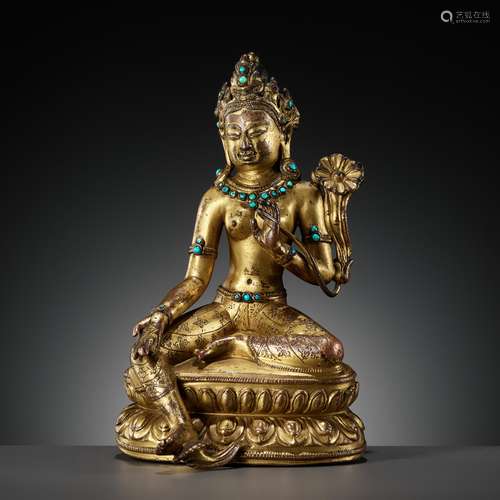 A GILT AND TURQUOISE-INLAID COPPER ALLOY FIGURE OF GREEN TAR...