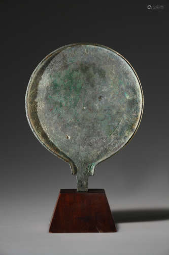 A WESTERN-GREEK OR ETRUSCAN ENGRAVED BRONZE MIRROR WITH ORNA...