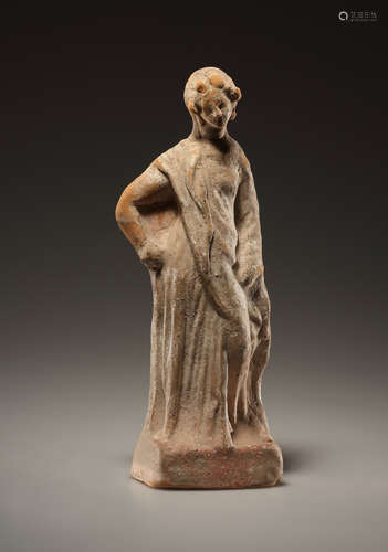 A WESTERN GREEK TERRACOTTA STATUETTE OF A WREATHED YOUNG WOM...