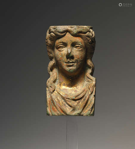 A GREEK HELLENISTIC GILDET BRONZE FITTING IN THE SHAPE OF A ...