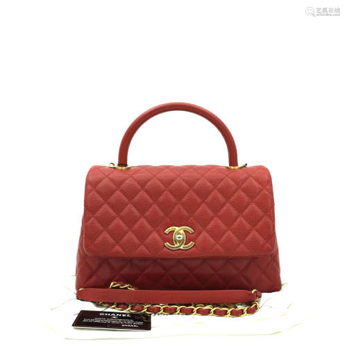 A CHANEL MEDIUM  COCOHANDLE IN RED CAVIAR LEATHER