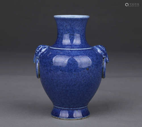 A POWDER-BLUE-GLAZED ELEPHANT-HANDLED VASE