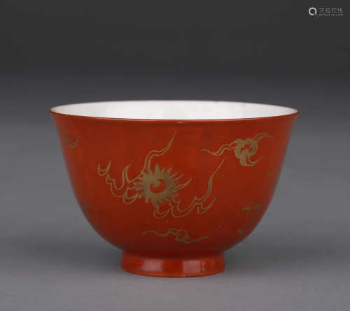 A GILT-DECORATED RED-GROUND DRAGON CUP