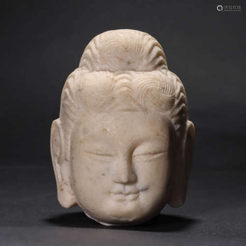 A CARVED JADE HEAD OF BUDDHA