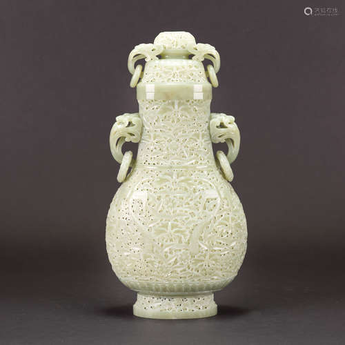 A CARVED CELADON WHITE JADE VASE AND COVER