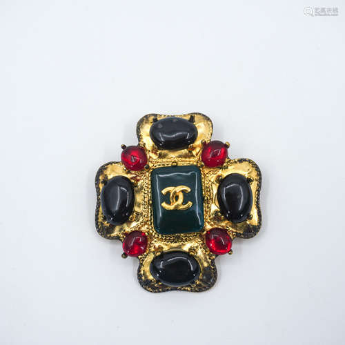 A CHANEL VINTAGE COLORED GLAZE BROOCH