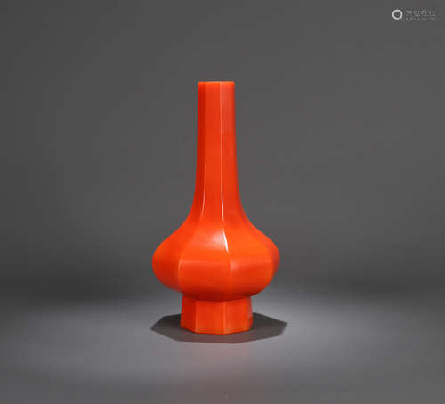 A CORAL-RED MELON-RIBBED LONG-NECKED VASE