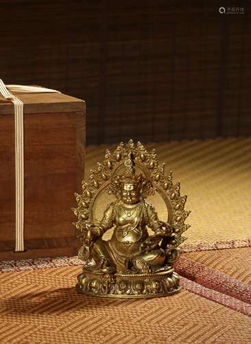 A  GILT-BRONZE FIGURE OF JAMBHALA,QING DYNASTY