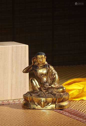A GILT-BRONZE FIGURE OF MILAREPA,QING,DYNASTY